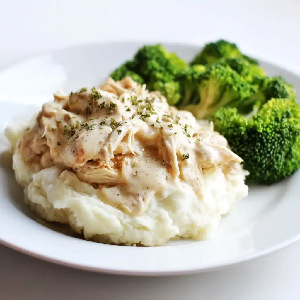 creamy crockpot chicken with cream of chicken soup served with mashed potatoes and broccoli